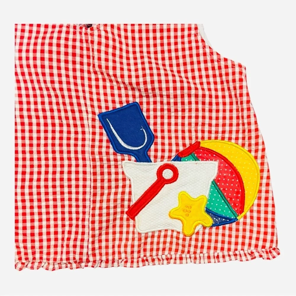 Girls 6 Samara gingham white red apron ruffled hem button detail graphic design